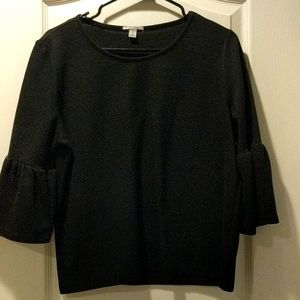 Cozy black blouse with bell sleeves.